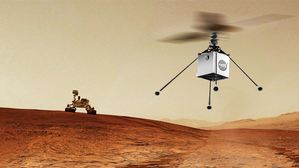 Animação com Mars Helicopter da NASA, um pequeno helicóptero autônomo, que viajará com o rover Mars 2020 (visto ao fundo) da NASA. Ambos estão programados para ser lançados em julho de 2020. A finalidade é demonstrar a viabilidade e o potencial de veículos mais pesados que o ar no Planeta Vermelho. (Crédito: NASA / JPL-Caltech)