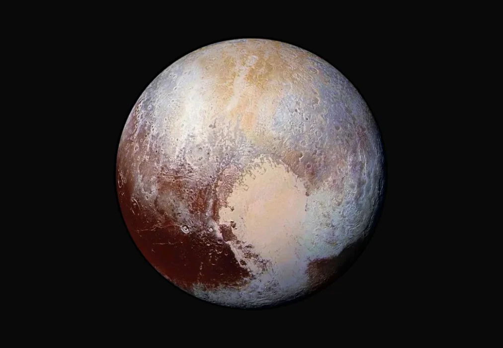 Enhanced view of Pluto revealing a heart shaped region of glaciers